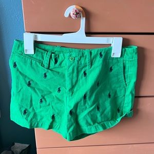 Green shirt with navy blue Ralph Lauren logo pattern over